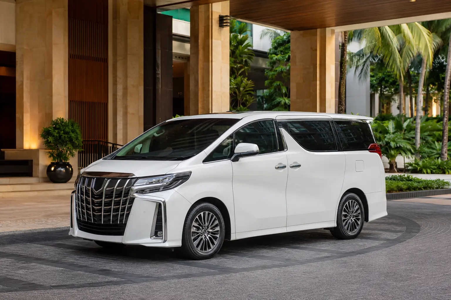 Premium private minivan at a tropical Bangkok hotel entrance